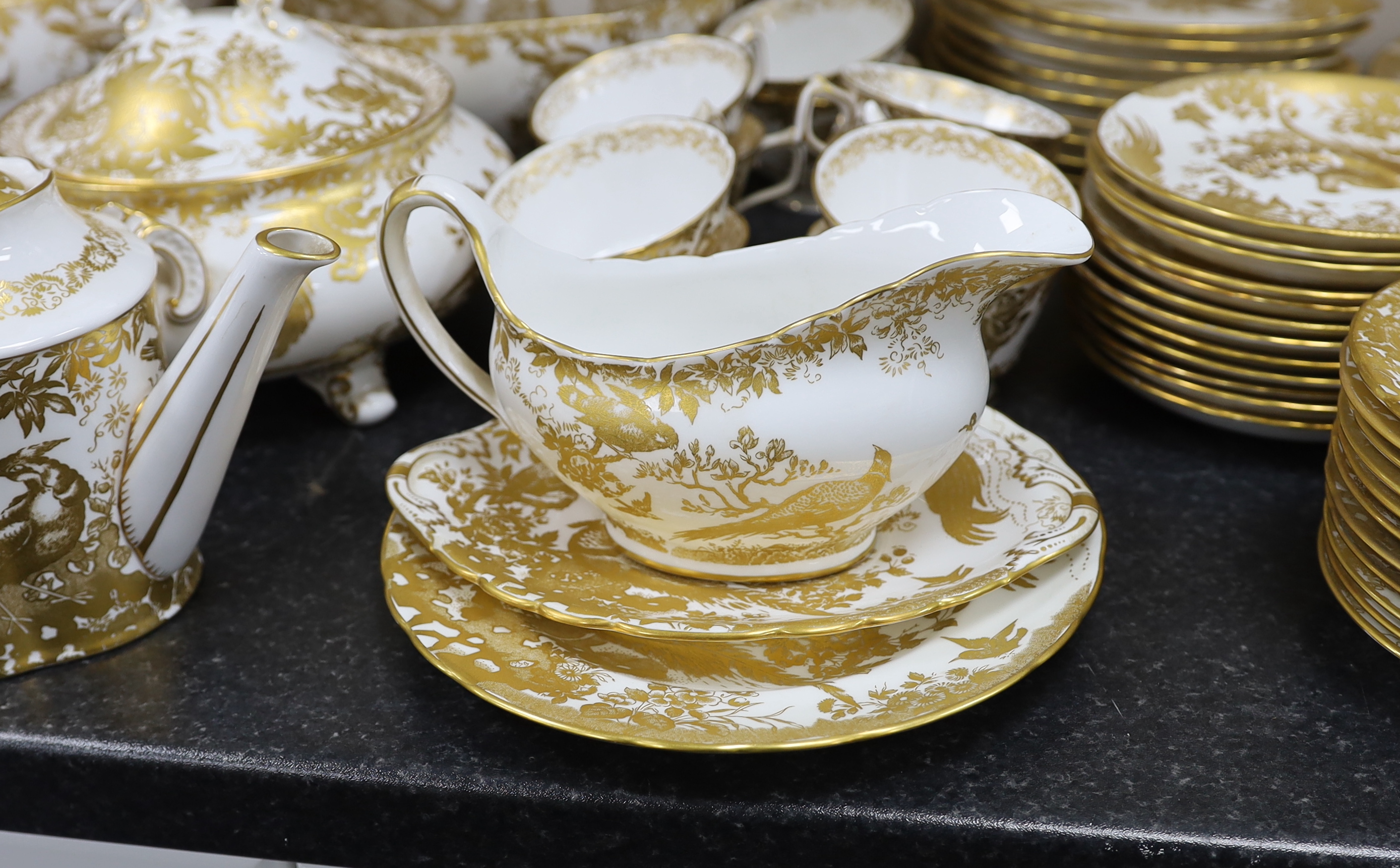 An extensive Royal Crown Derby Gold Aves dinner and tea service